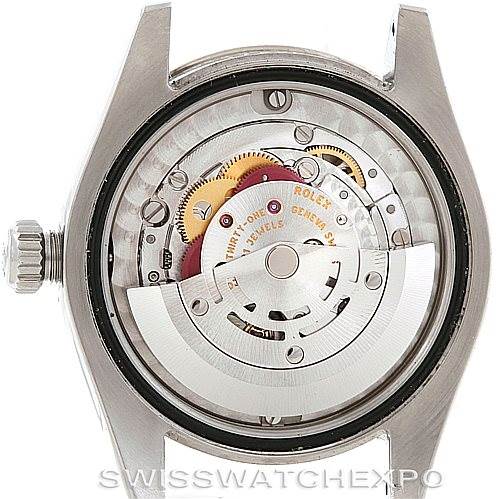 This image shows the back view of a Mid-Size Rolex watch, revealing its intricate internal movement.