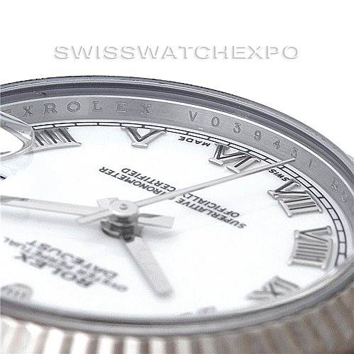 This image shows a close-up of the Rolex Mid-Size 178274 Women's Stainless Steel White Dial 178274 Women's Stainless Steel White Dial watch's dial and part of the rehaut with engravings.