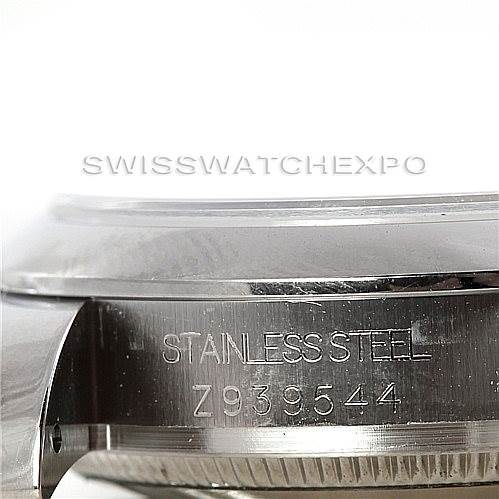 The image shows a side angle of the case back of a Rolex Mid-Size 178240 Women's Stainless Steel White Dial 178240 Women's Stainless Steel White Dial watch, displaying the stainless steel material and the serial number.