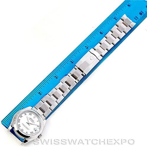 This image shows a Rolex Mid-Size 178240 Women's Stainless Steel White Dial 178240 Women's Stainless Steel White Dial model watch laid flat next to a blue ruler, displaying the watch face, band, and clasp.