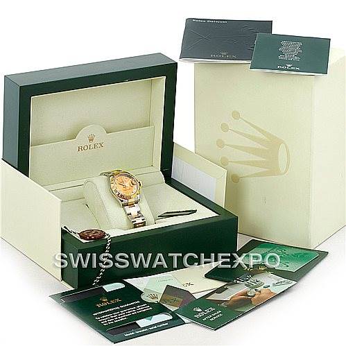 The image shows a Mid-Size Rolex watch in its box, accompanied by various warranties and manuals.