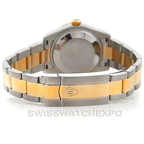 The image shows the back view of a Mid-Size Rolex watch, highlighting its two-tone bracelet and clasp with the Rolex logo.