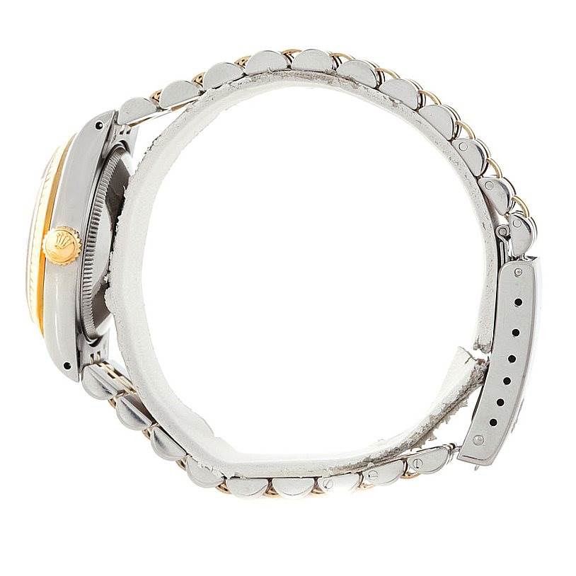 The image shows a side view of a Mid-Size Rolex watch featuring its case, crown, and part of the bracelet.