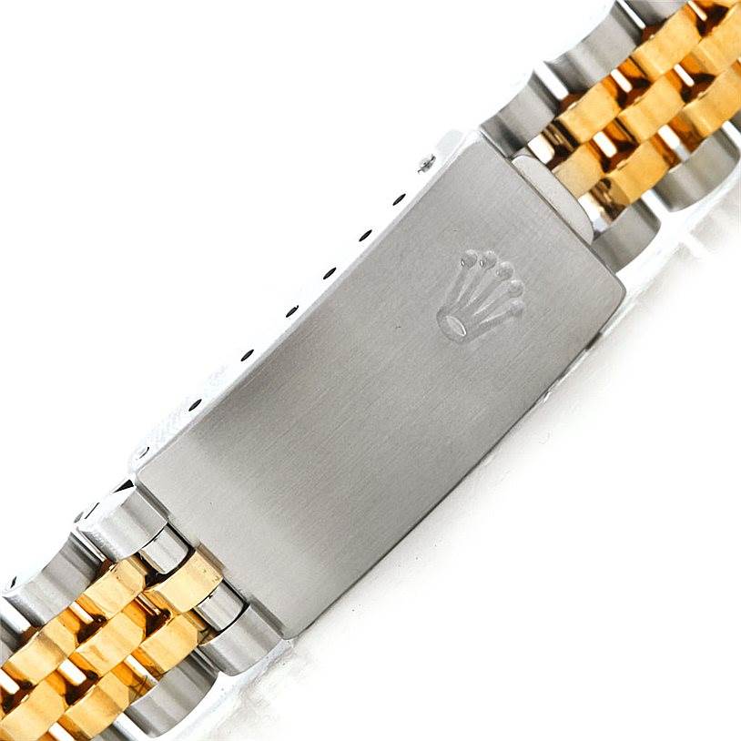 This image shows a close-up of the clasp and bracelet of a Mid-Size Rolex watch, highlighting the metal and gold links.