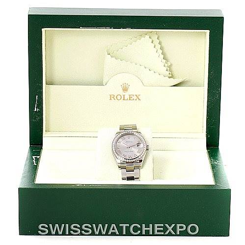 The image shows a Rolex Mid-Size 178384 Women's Stainless Steel Grey Dial 178384 Women's Stainless Steel Grey Dial watch placed frontally in an open Rolex box, with cleaning cloths in the background.