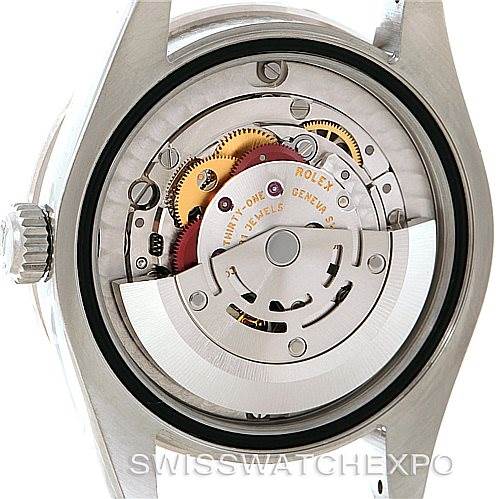 This image shows the inside of a Rolex Mid-Size 178384 Women's Stainless Steel Grey Dial 178384 Women's Stainless Steel Grey Dial watch, highlighting the movement and mechanical parts from a back view angle.