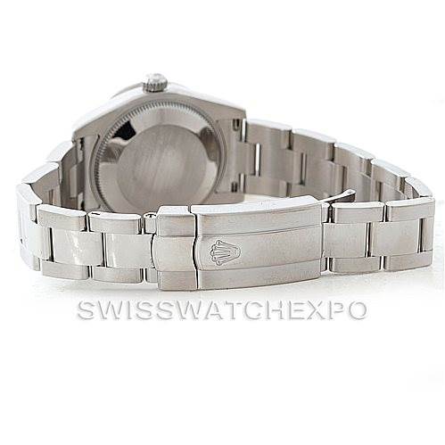 The image shows the backside and bracelet of a mid-size Rolex watch, focusing on the clasp and case back.