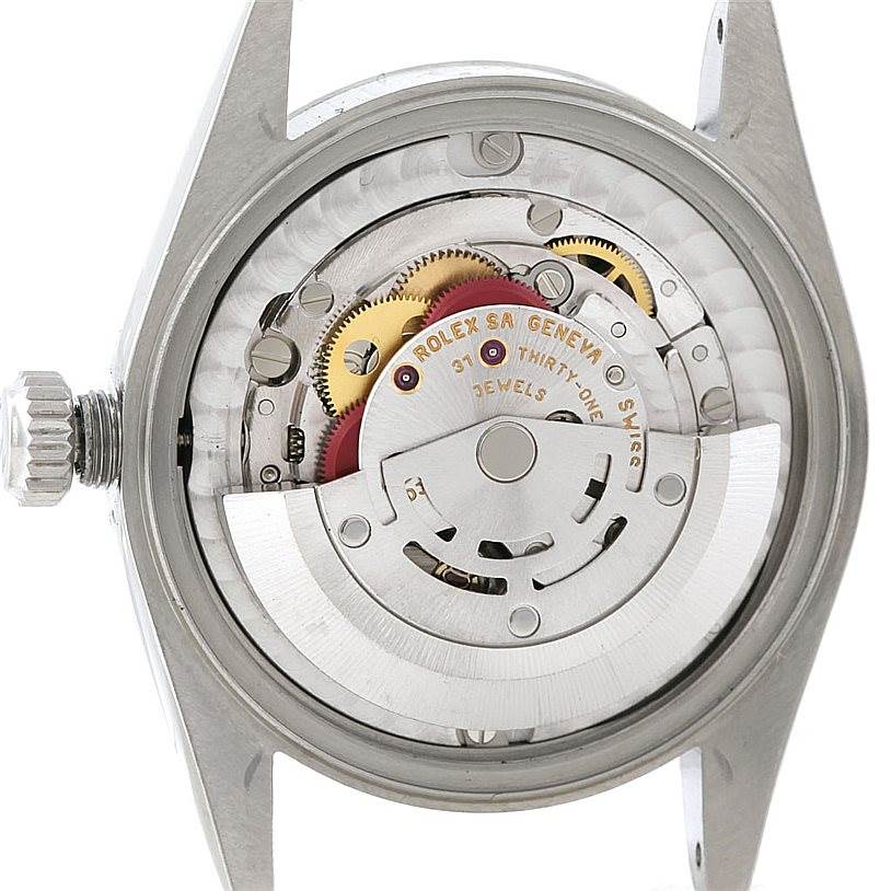 This image shows the inner mechanical movement of a Mid-Size Rolex watch from a back view.
