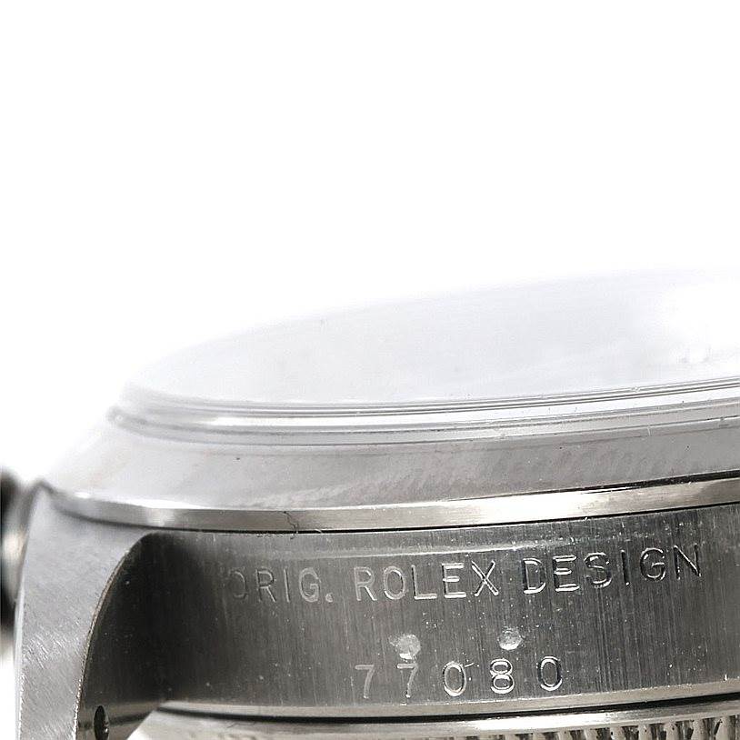 This image shows a close-up side view of the case and bezel with the serial number of a Rolex Mid-Size 77080 Women's Stainless Steel Black Dial 77080 Women's Stainless Steel Black Dial watch model.