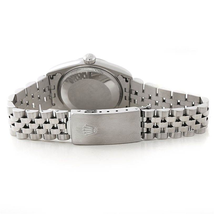 The image shows the back view of a Rolex Mid-Size 77080 Women's Stainless Steel Black Dial 77080 Women's Stainless Steel Black Dial model watch, highlighting the case back and Jubilee bracelet with clasp.