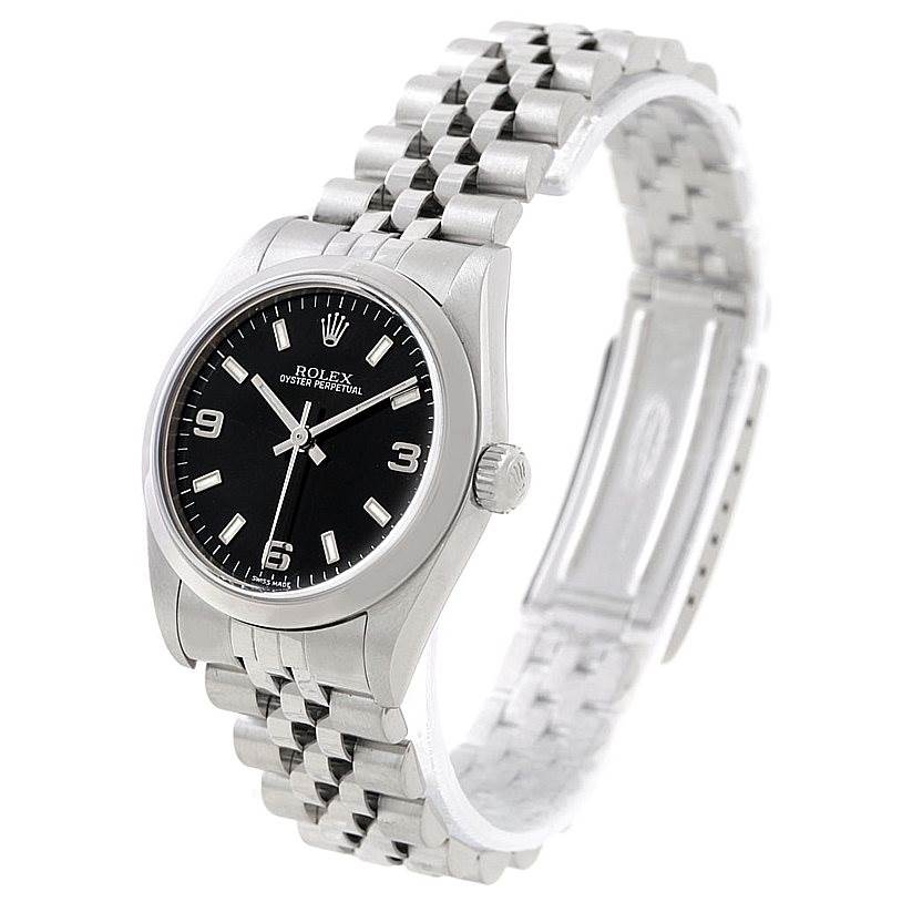 The Rolex Mid-Size 77080 Women's Stainless Steel Black Dial 77080 Women's Stainless Steel Black Dial model watch is shown at a slight angle, highlighting its black dial, bezel, crown, and metal bracelet.