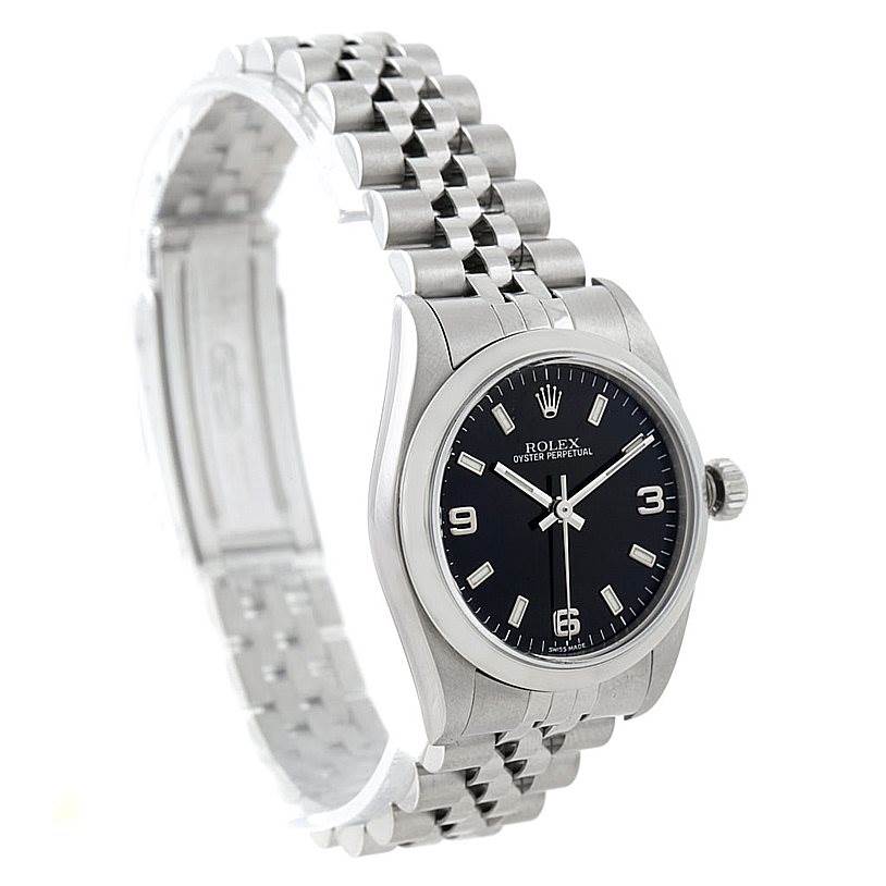 The image shows a side angle of the Rolex Oyster Perpetual Mid-Size watch, focusing on its face, bezel, crown, and bracelet.