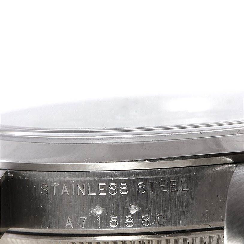 This image shows a close-up of the stainless steel case back and serial number of a Rolex Mid-Size 77080 Women's Stainless Steel Black Dial 77080 Women's Stainless Steel Black Dial model watch.