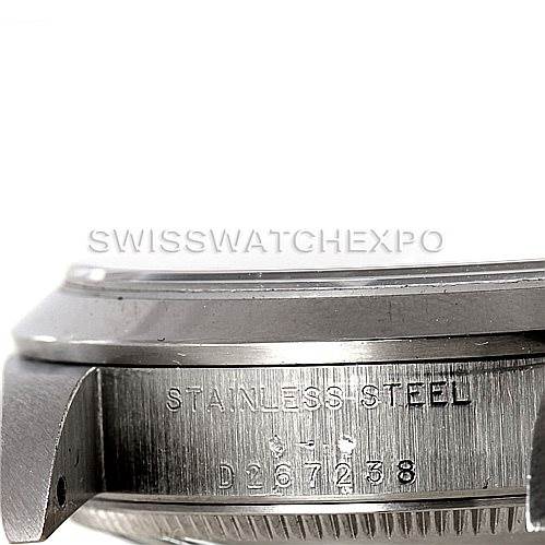 The image shows a close-up of the side of a stainless steel Rolex Mid-Size 78240 Women's Stainless Steel Black Dial 78240 Women's Stainless Steel Black Dial model watch case, featuring the serial number.