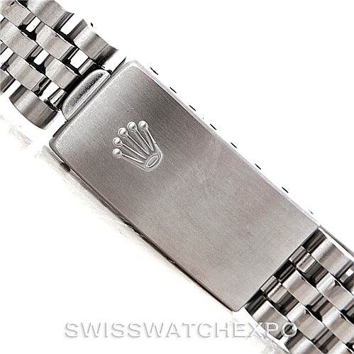 This image shows a close-up view of the bracelet clasp of a Mid-Size Rolex watch with the brand's logo.