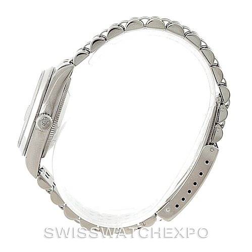 This side view of the Rolex Mid-Size 78240 Women's Stainless Steel Black Dial 78240 Women's Stainless Steel Black Dial model shows the watch case, crown, and full bracelet with clasp, displaying its thickness and design details.