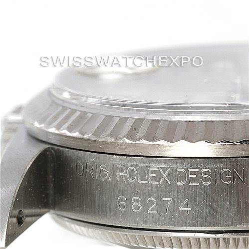 Close-up side view of a Rolex Mid-Size 68274 Women's Stainless Steel Silver Dial 68274 Women's Stainless Steel Silver Dial watch, showing the bezel, case, and model number 68274 engraving.