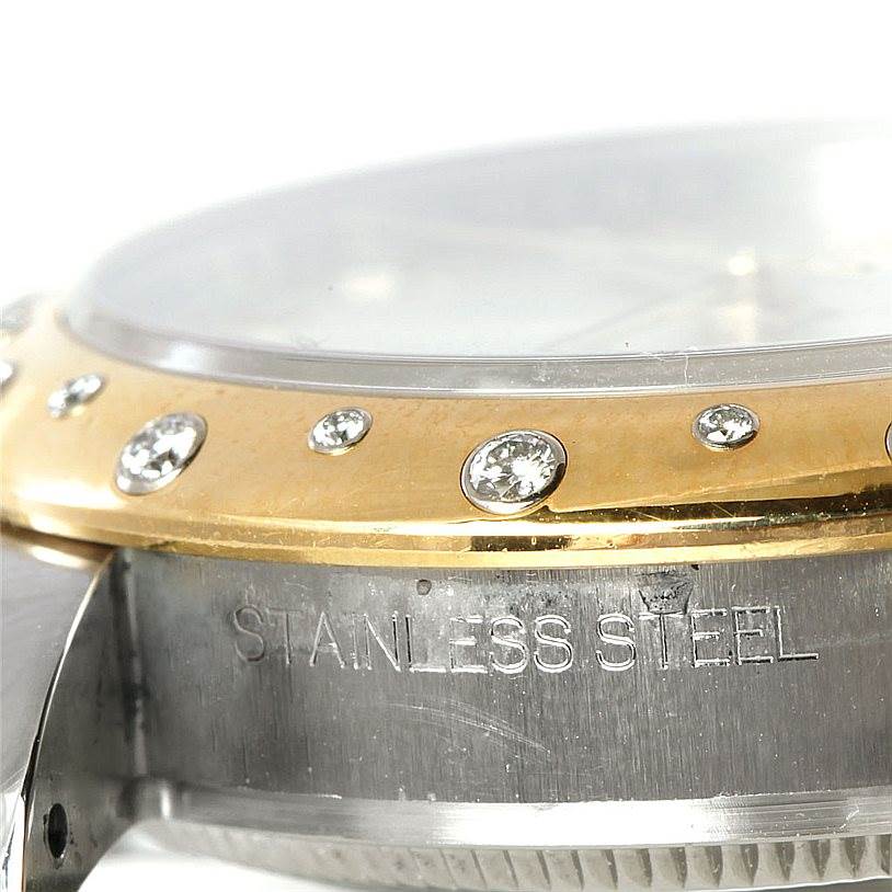 The image shows a close-up side view of a Mid-Size Rolex watch, highlighting its stainless steel case and diamond-studded gold bezel.