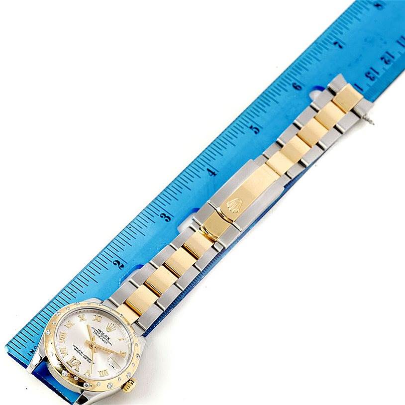 The Rolex Mid-Size 178343 Women's Stainless Steel Silver Dial 178343 Women's Stainless Steel Silver Dial watch is photographed from above, showing the face, bracelet, and clasp.