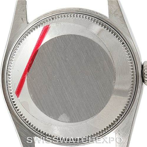 The image shows the back case of a Rolex Mid-Size 77080 Women's Stainless Steel Blue Dial 77080 Women's Stainless Steel Blue Dial model watch at a top-down angle.