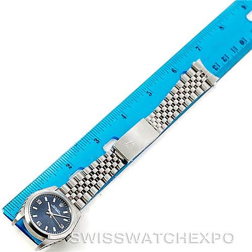 The image shows the Rolex Mid-Size 77080 Women's Stainless Steel Blue Dial 77080 Women's Stainless Steel Blue Dial watch laid flat next to a ruler, highlighting the full length of the bracelet and the face of the watch.