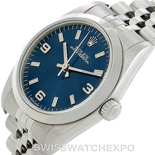 The image shows a Rolex Mid-Size 77080 Women's Stainless Steel Blue Dial 77080 Women's Stainless Steel Blue Dial model watch at an angled view, displaying the face, crown, and bracelet.
