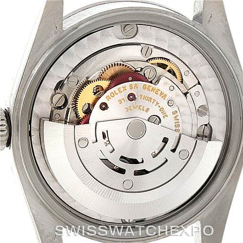 This image shows a rear view of the intricate movement of a Rolex Mid-Size 77080 Women's Stainless Steel Blue Dial 77080 Women's Stainless Steel Blue Dial watch.