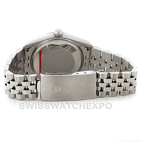 The image shows the back view of a Mid-Size Rolex watch, highlighting the case back, crown, and bracelet with a clasp.