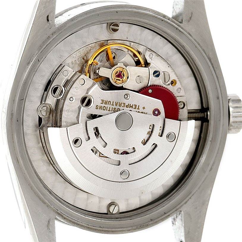The image shows the internal mechanism from the rear of the Rolex Mid-Size 67480 Women's Stainless Steel White Dial 67480 Women's Stainless Steel White Dial watch model.