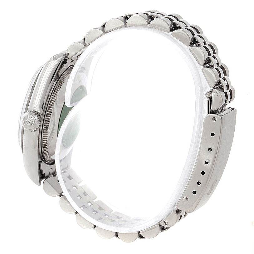 The image shows the side view of a Mid-Size Rolex watch, highlighting the crown, case, and part of the bracelet.