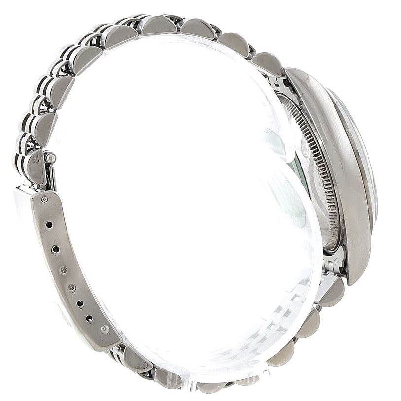 The image shows a side view of a Rolex Mid-Size 67480 Women's Stainless Steel White Dial 67480 Women's Stainless Steel White Dial model, highlighting the bracelet, clasp, and watch case.