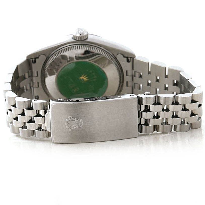 The image shows the back and clasp of a Mid-Size Rolex watch, highlighting the bracelet and case back.