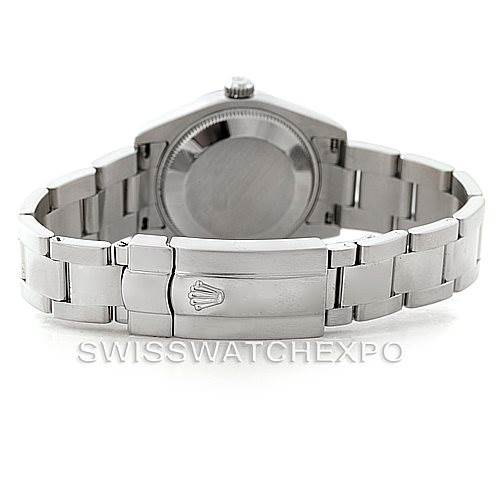 The image shows the backside and the bracelet clasp of a Mid-Size Rolex watch.