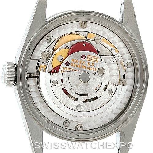 The image shows the back view of a Mid-Size Rolex watch, revealing the inner mechanical movements and components.