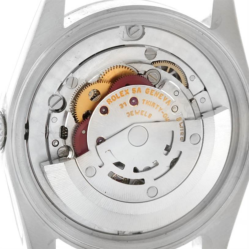 This image shows the Rolex Mid-Size 78240 Women's Stainless Steel White Dial 78240 Women's Stainless Steel White Dial model's movement and internal mechanism parts from the back.