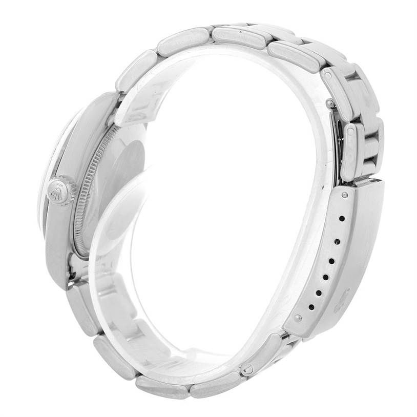 The image shows a side angle of a Rolex Mid-Size 78240 Women's Stainless Steel White Dial 78240 Women's Stainless Steel White Dial watch, highlighting the bracelet and the crown.