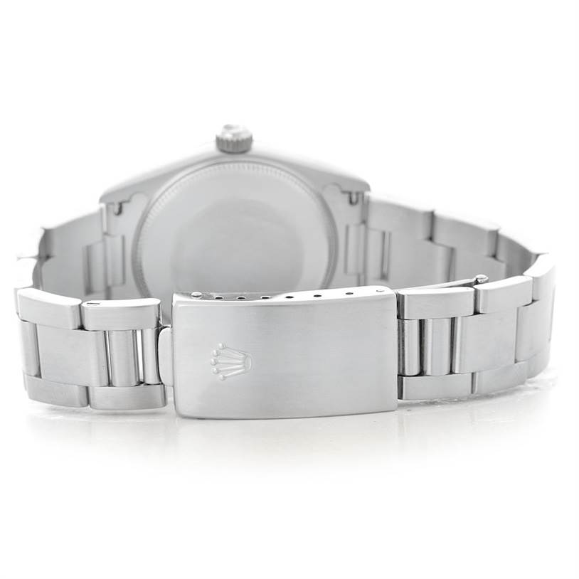 The image shows the back and clasp of a Rolex Mid-Size 78240 Women's Stainless Steel White Dial 78240 Women's Stainless Steel White Dial watch, displaying its metal bracelet and engraved crown logo on the clasp.