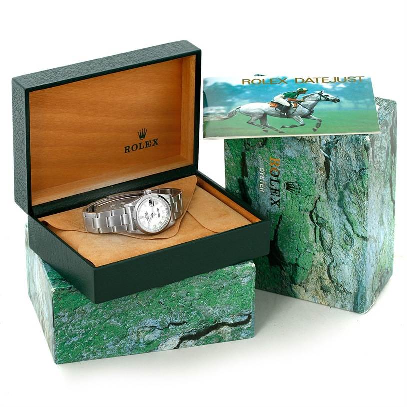 The Rolex Mid-Size 78240 Women's Stainless Steel White Dial 78240 Women's Stainless Steel White Dial model watch is shown inside its open box with accompanying booklet and outer packaging visible.