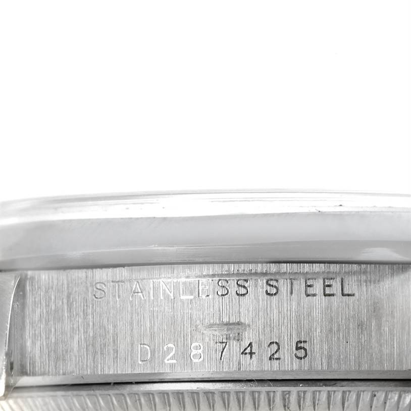 The image shows the side view of a stainless steel Rolex Mid-Size 78240 Women's Stainless Steel White Dial 78240 Women's Stainless Steel White Dial watch, highlighting its serial number.