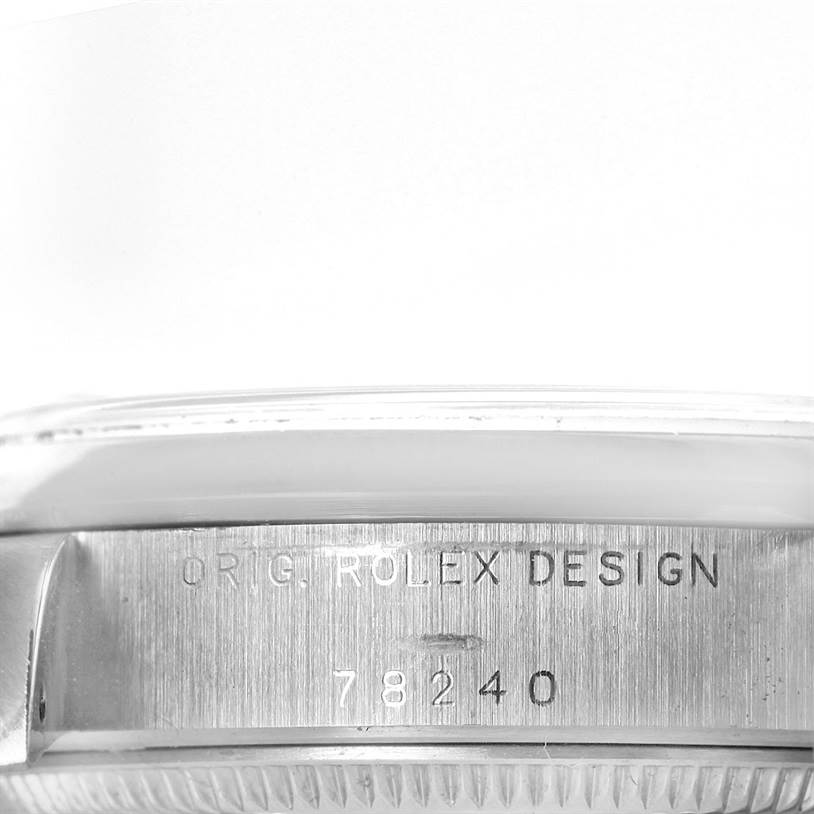 The image shows a close-up side view of a Rolex Mid-Size 78240 Women's Stainless Steel White Dial 78240 Women's Stainless Steel White Dial model with the engraved text "ORIG. ROLEX DESIGN" and the model number "78240."