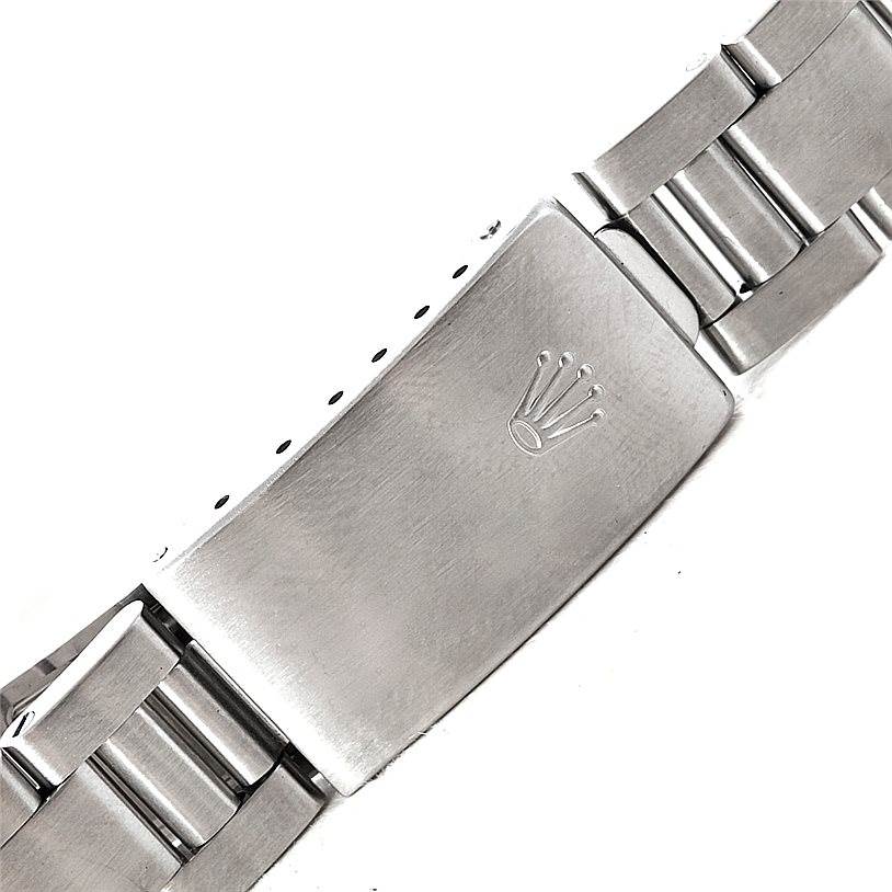 This image shows the clasp and part of the bracelet of a Mid-Size Rolex watch.