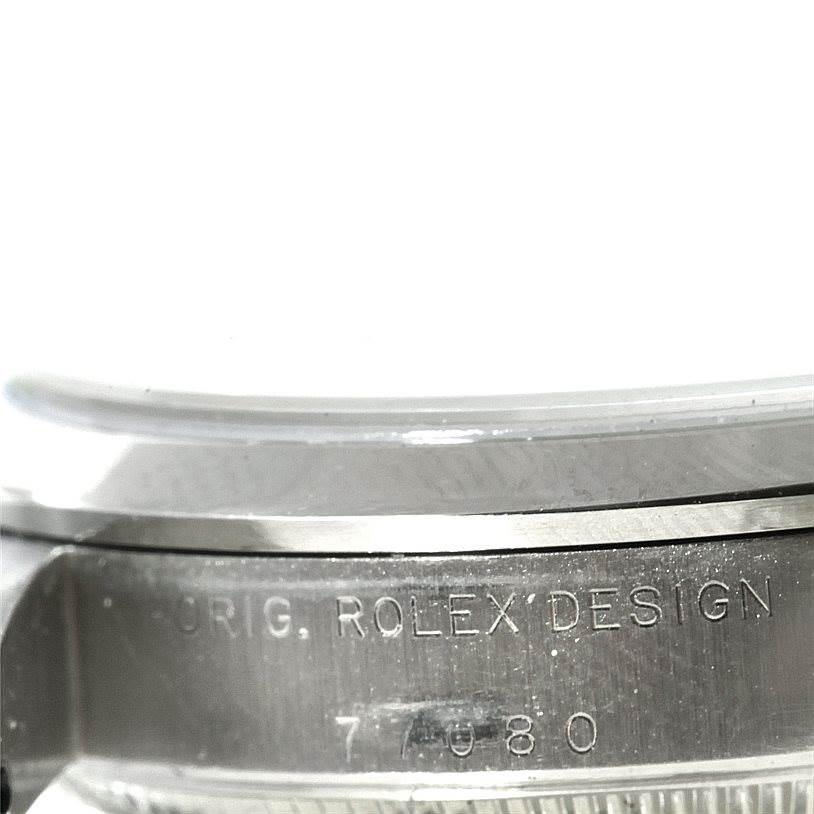 The image shows the side case of a Mid-Size Rolex watch, highlighting the engraved model number and "ORIG. ROLEX DESIGN".