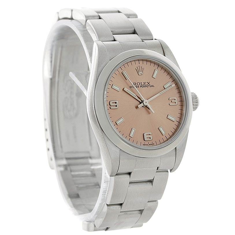 This image shows a side angle of a Rolex Mid-Size 77080 Women's Stainless Steel Pink Dial 77080 Women's Stainless Steel Pink Dial Oyster Perpetual watch, highlighting its bracelet, case, and dial.