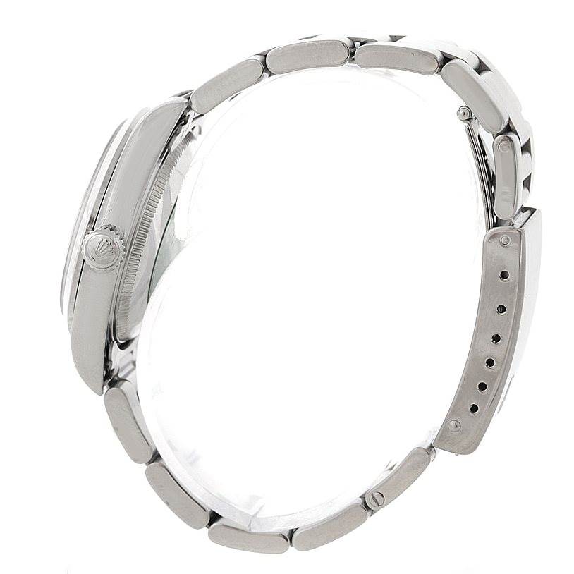 The side view of the Rolex Mid-Size 77080 Women's Stainless Steel Pink Dial 77080 Women's Stainless Steel Pink Dial model shows the case, crown, and bracelet.