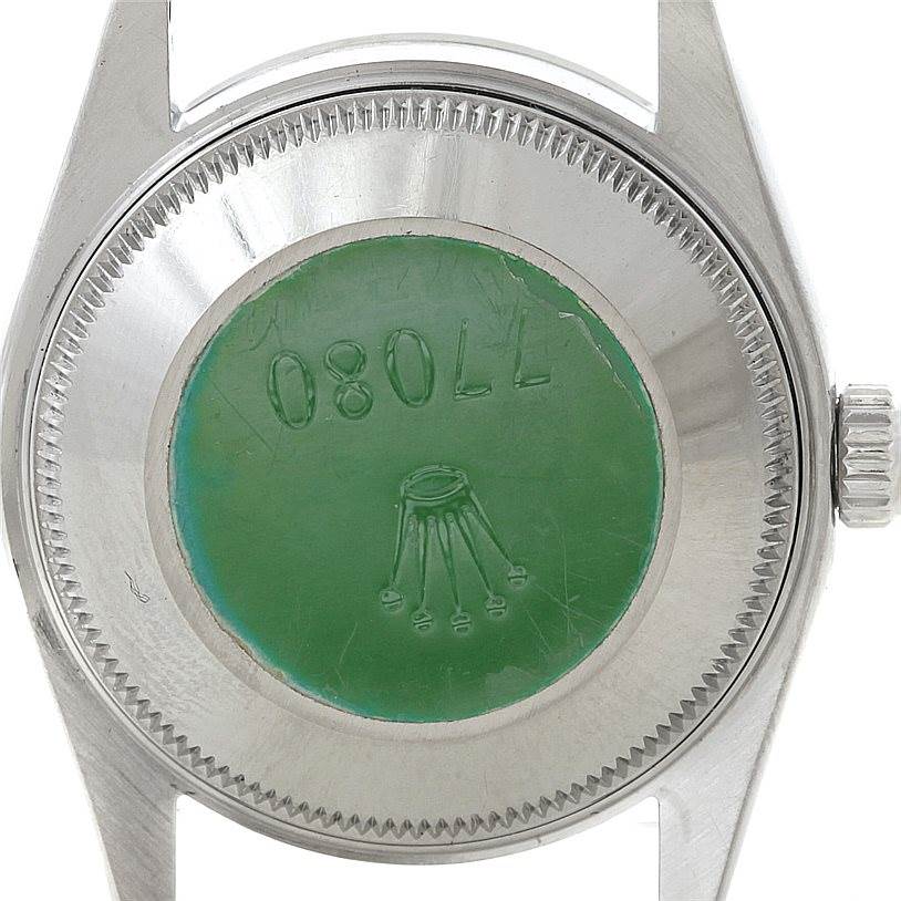 The image shows the case back of a Mid-Size Rolex watch viewed from the rear.