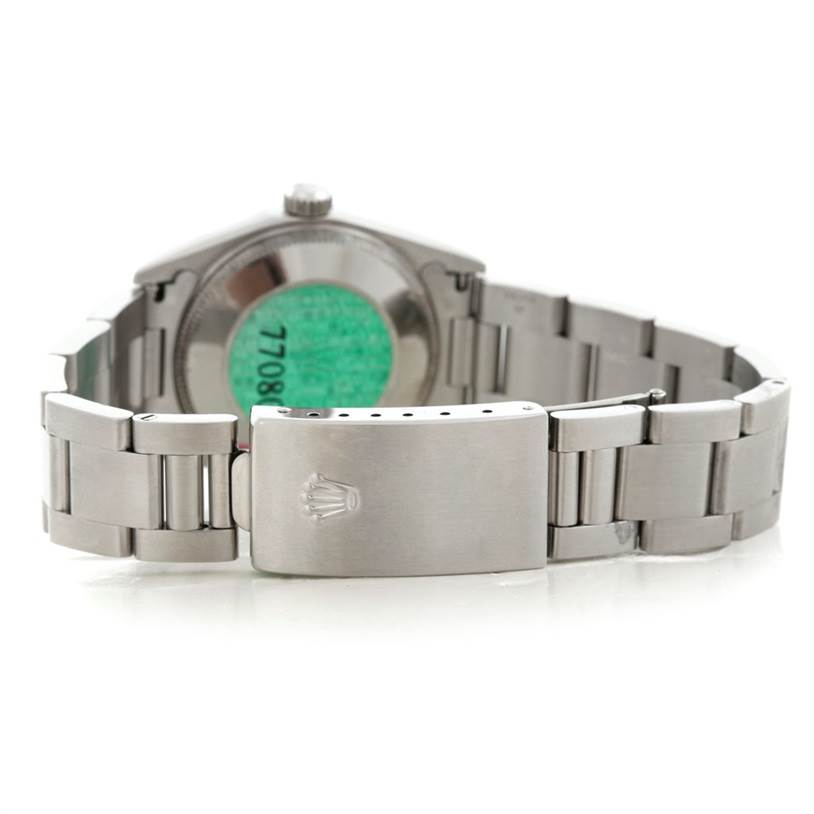 The image shows the back of the case, the bracelet, and the clasp of a Rolex Mid-Size 77080 Women's Stainless Steel Black Dial 77080 Women's Stainless Steel Black Dial model watch.