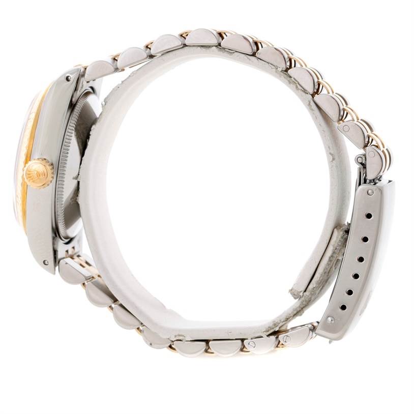 This side view of the Rolex Mid-Size 68273 Women's Stainless Steel Champagne Dial 68273 Women's Stainless Steel Champagne Dial model watch shows the crown, case, and bracelet.