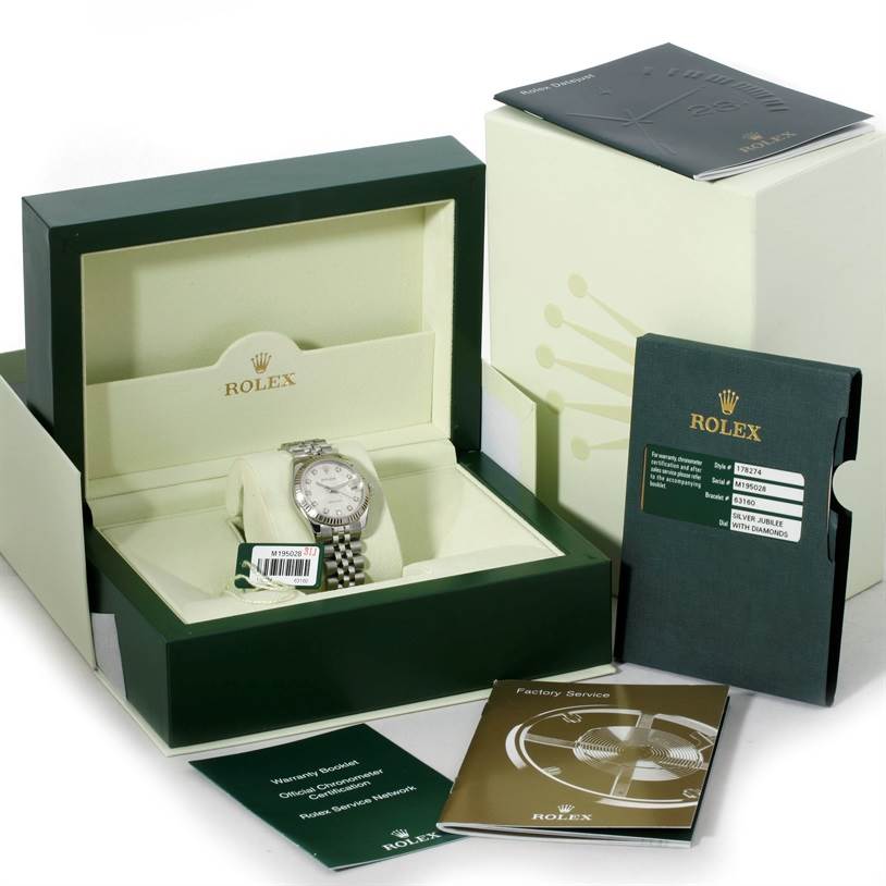 The image shows a Rolex Mid-Size 178274 Women's Stainless Steel Silver Dial 178274 Women's Stainless Steel Silver Dial watch in its box along with instruction booklets and warranty cards.