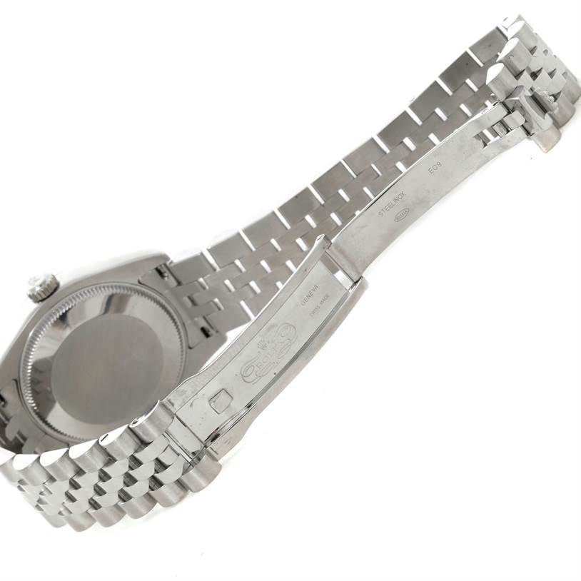 This image shows the case back and bracelet of a mid-size Rolex watch, with the clasp opened and the logo visible.