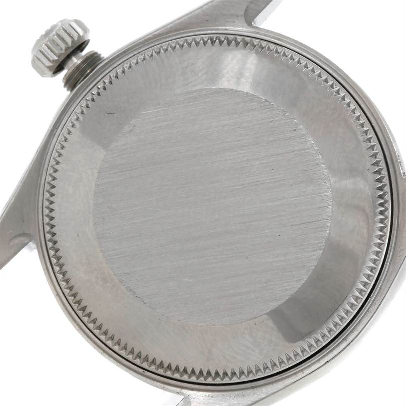 This is a close-up of the back case and crown of a Rolex Mid-Size 78274 Women's Stainless Steel Mother of Pearl Dial 78274 Women's Stainless Steel Mother of Pearl Dial model watch, showing its brushed metal finish.